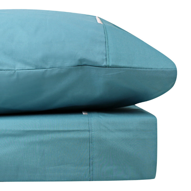 Close-up look of a teal sheet set made from 100% cotton showcasing fresh appearance, ultimate softness and cottony comfort.