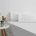 A stunning white breathe cotton fitted sheet in a bedroom setup.