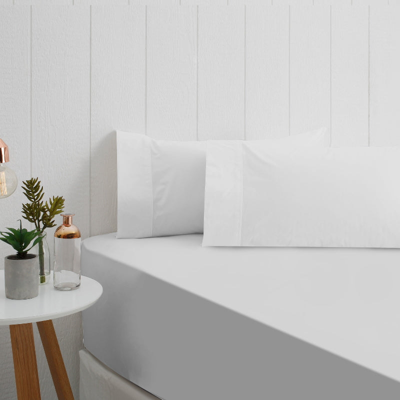 A stunning white breathe cotton fitted sheet in a bedroom setup.