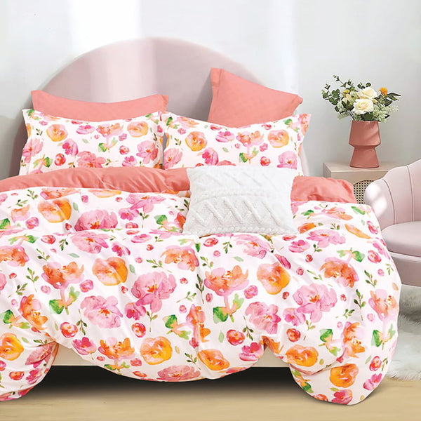 The Bryony Cotton Multi Quilt Cover Set showcases large pink and orange flowers with green leaves, perfect for a lively bedroom retreat.