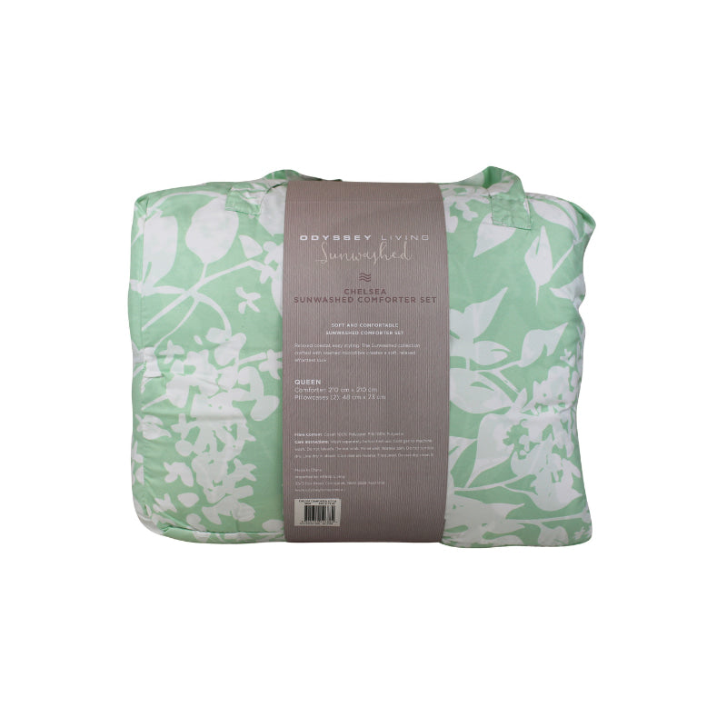 Back packaging details of a white and green comforter in a bedroom, adding a touch of organic beauty