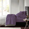 Stylish plum bed adorned with premium Egyptian cotton sheet set of Park Avenue for exceptional comfort and elegance.