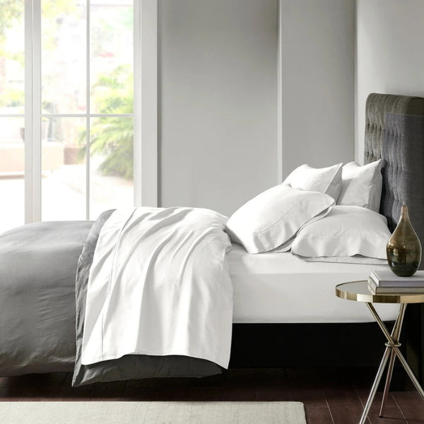 Stylish white bed adorned with premium Egyptian cotton sheet set of Park Avenue for exceptional comfort and elegance.