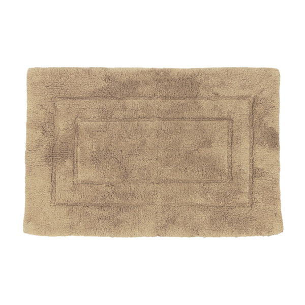 Cosy plaster bath mat in cotton, designed for softness and warmth, perfect for chilly bathroom tiles.