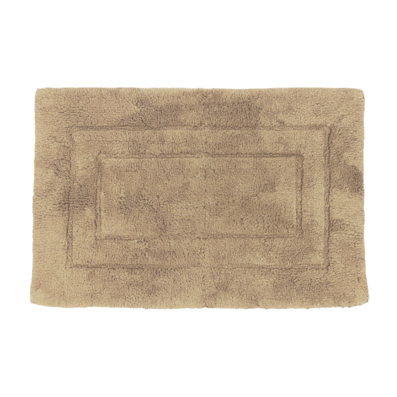 Cosy plaster bath mat in cotton, designed for softness and warmth, perfect for chilly bathroom tiles.