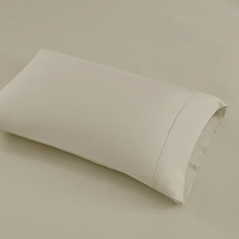 A bone pillowcase highlighting the eco-friendly and breathable features of Renee Taylor.