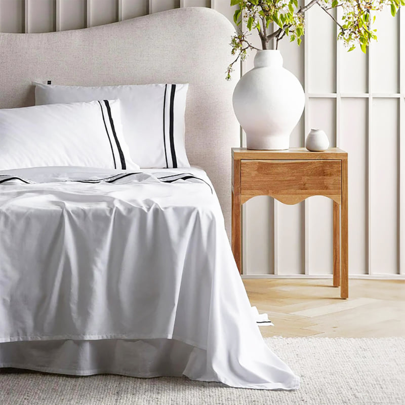 Opulent Renee Taylor Cloud Sheet Set featuring 1000-thread count Egyptian cotton, available in white with chic charcoal edges.