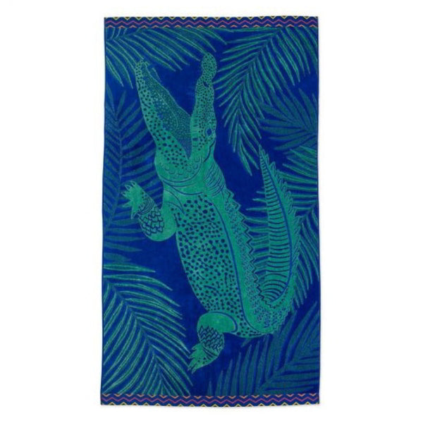 Colourful crocodile beach towel emphasizing its plush feel and stylish design for beach relaxation.