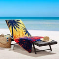 A beach chair adorned with a vibrant sunset palm beach towel, showcasing luxurious comfort and stylish design for relaxation.