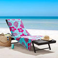 A beach chair adorned with a vibrant tropicalia beach towel, showcasing luxurious comfort and stylish design for relaxation.