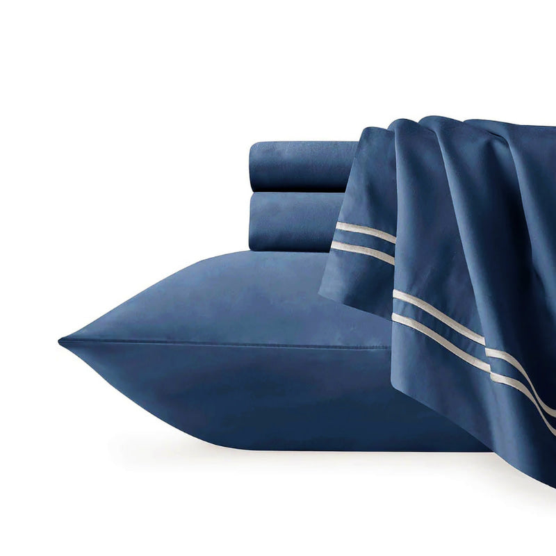 Elegant indigo European pillowcase made from 1000 thread count Egyptian cotton, featuring intricate embroidery for added luxury.