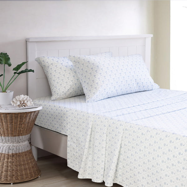 The Diamond Palm Sheet Set features a soothing white sheet and pillowcases that highlight its calm appeal.