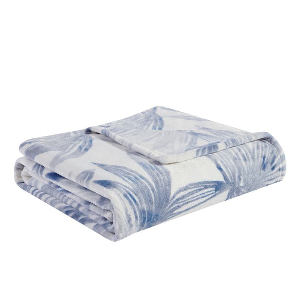 Soft plush polyester throw with tranquil blues palm leaf design for warmth.