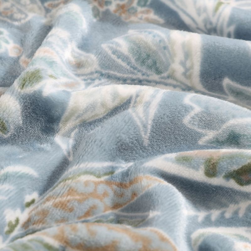 Detailed shot of the island-inspired colours and print motifs create a stylish ambiance for relaxation, made from super soft plush polyester for extra warmth.