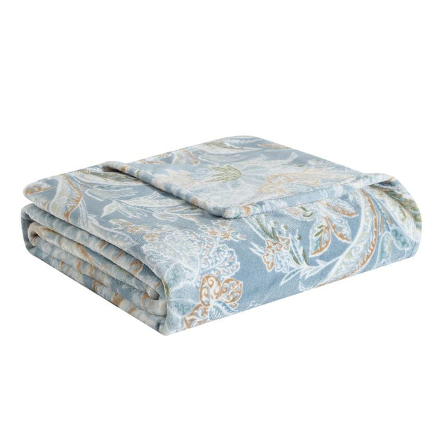 Island-inspired blue-and-white floral throw adds style and warmth to your home décor.