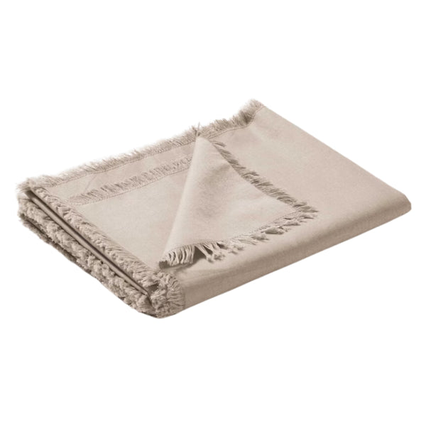 Elegant natural table runner made from linen cotton blend, featuring fringed edges for a vintage touch to dining experiences.