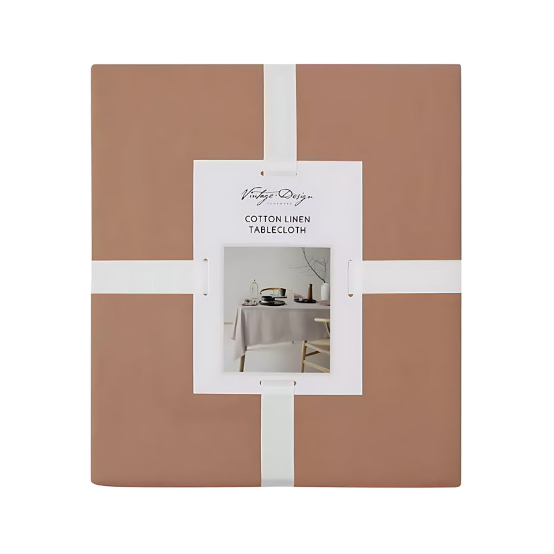 Packaging details of a terracotta tablecloth made of linen and cotton, featuring a soft feel, fringe edges, and a versatile design for any occasion.