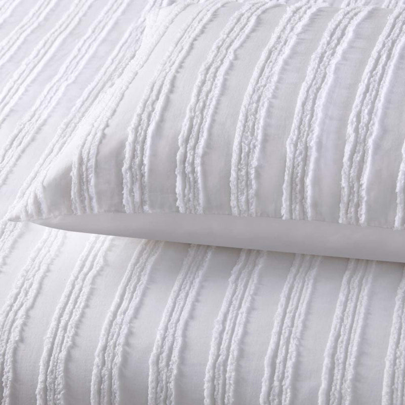 alt="Zoom in details of a white quilt cover set featuring chenille stripes and minimalistic style"