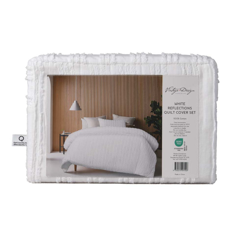 alt="Back packaging details of a white quilt cover set featuring chenille stripes and minimalistic style"