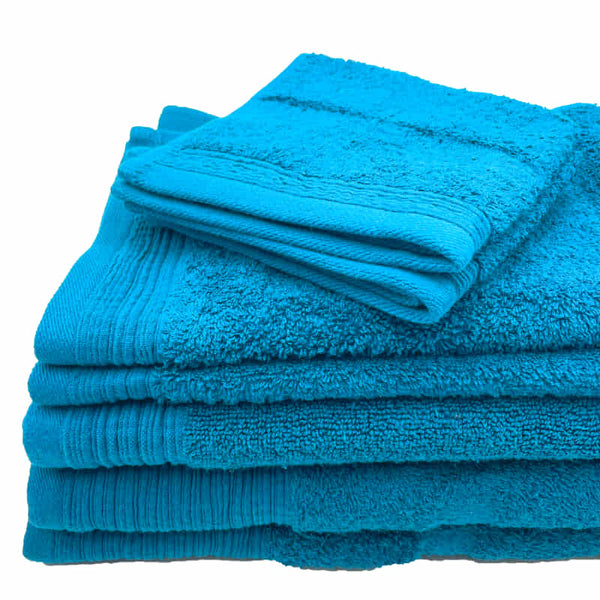 Luxurious aqua towels stacked neatly, emphasizing softness and absorbency for a relaxing bath.