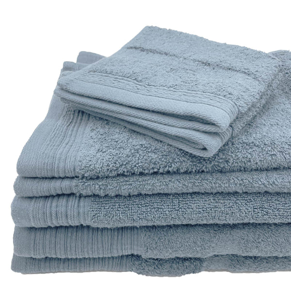 Luxurious baby blue towels stacked neatly, emphasizing softness and absorbency for a relaxing bath.