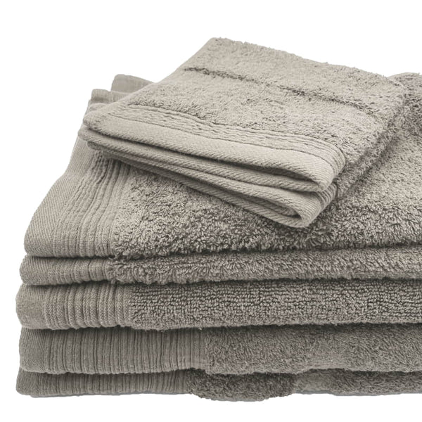 Luxurious silver towels stacked neatly, emphasizing softness and absorbency for a relaxing bath.