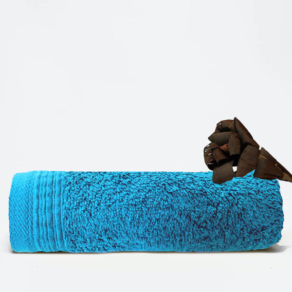 An aqua face towel showcasing elegance with a wide sheared border for a luxurious touch.