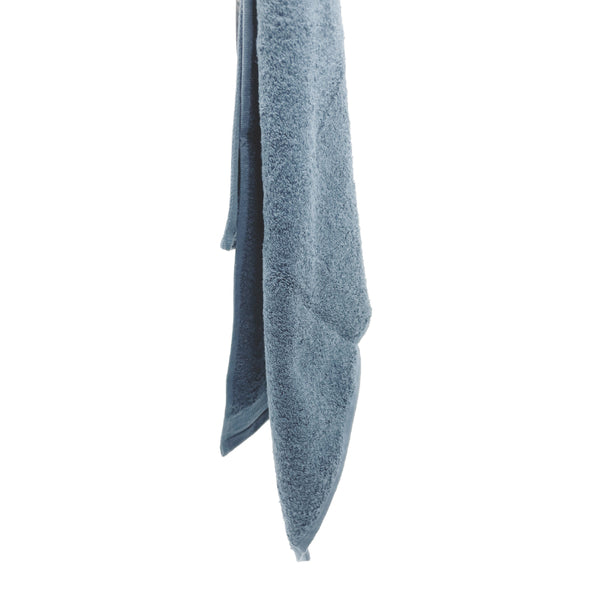 Soft baby blue hand towel featuring a wide sheared border, perfect for a spa-like experience.