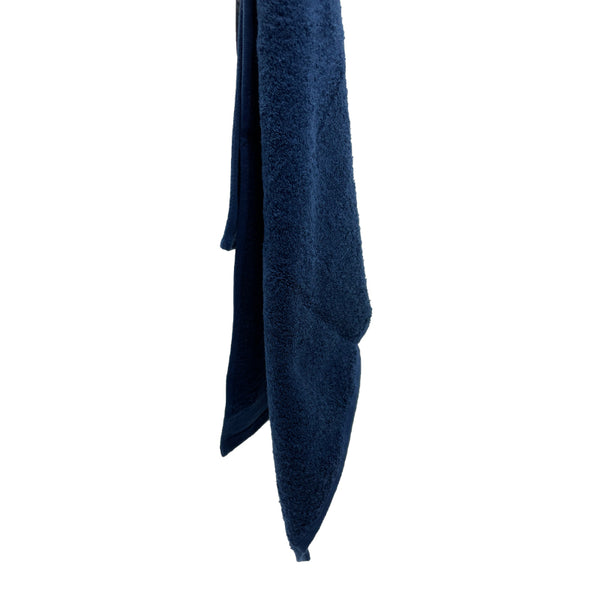 Soft navy hand towel featuring a wide sheared border, perfect for a spa-like experience.