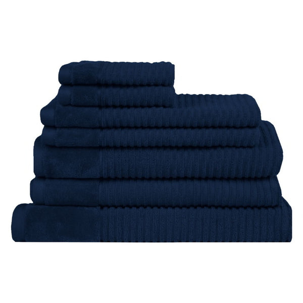 A stack of seven navy towels, showcasing their plush texture and elegant colour, ideal for comfort and durability in daily use.