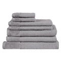 A stack of luxurious silver towels, crafted from 100% premium cotton, showcasing elegance and exceptional softness.