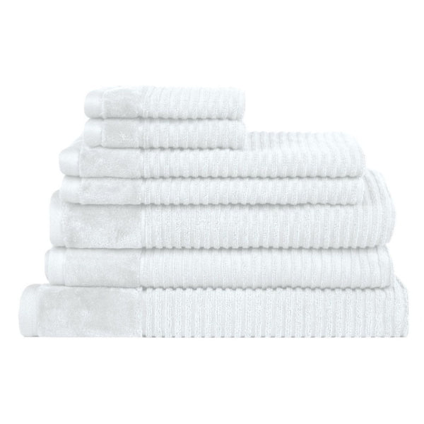 A stack of luxurious white towels, showcasing elegance and softness for an elevated bathing experience.