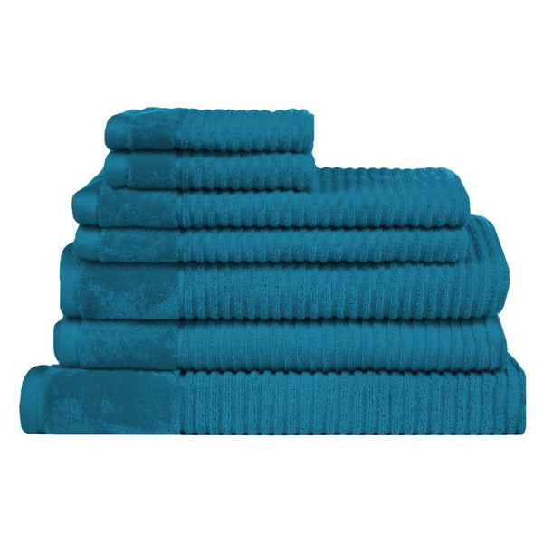 A stack of luxurious towels, showcasing their soft texture and elegant teal finish.