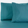 Luxurious 1000 thread count cotton-rich ocean blue sheet set, offering comfort, durability, and seasonal versatility for a restful sleep experience.