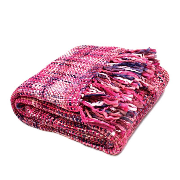 A vibrant pink fringed throw, perfect for summer picnics and beach days, adding style and comfort to any outing.