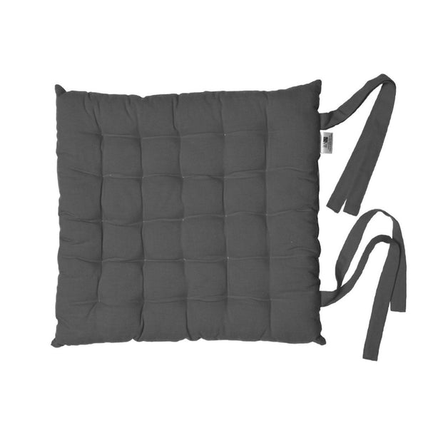 A charcoal chair pad with straps, designed for comfort and style, featuring a tufted look suitable for various seating arrangements.