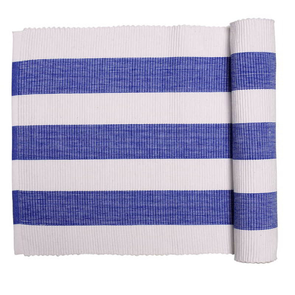 A cobalt blue table runner, perfect for indoor and outdoor use, enhancing any dining setting with a Mediterranean touch.