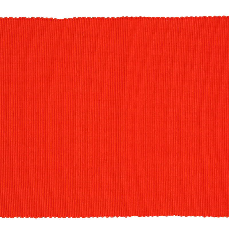 A sophisticated red ribbed placemat, enhancing dining experiences with style and protection.