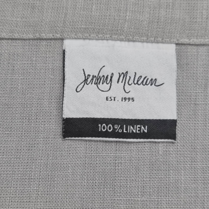 Front tag details of Venice grey linen napkin emphasizing the fabric used.