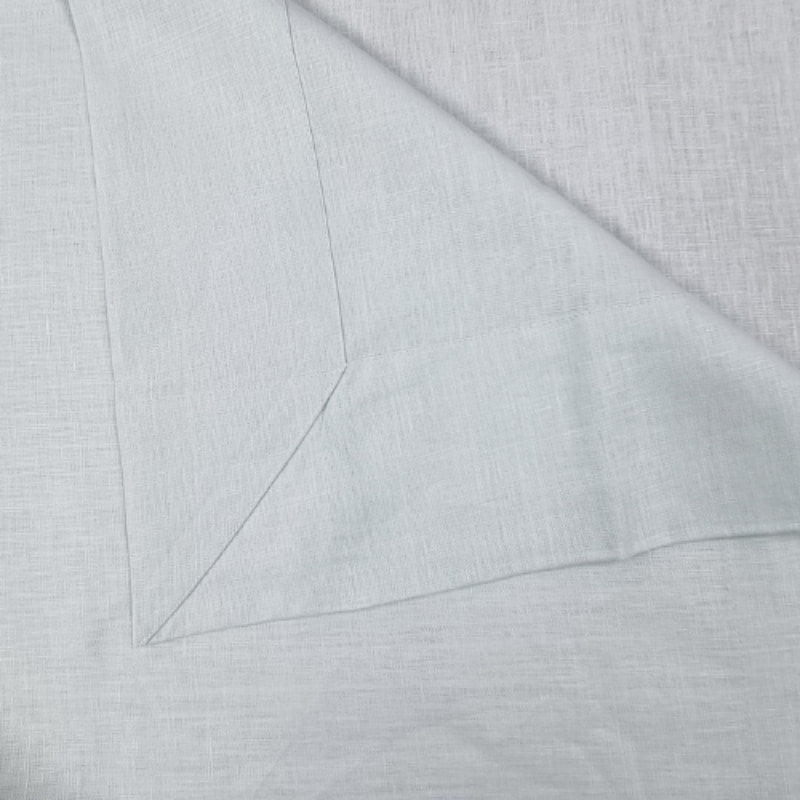 Detailed view of RANS Venice Linen Mist Tablecloth, highlighting its quality and sophistication for table settings.